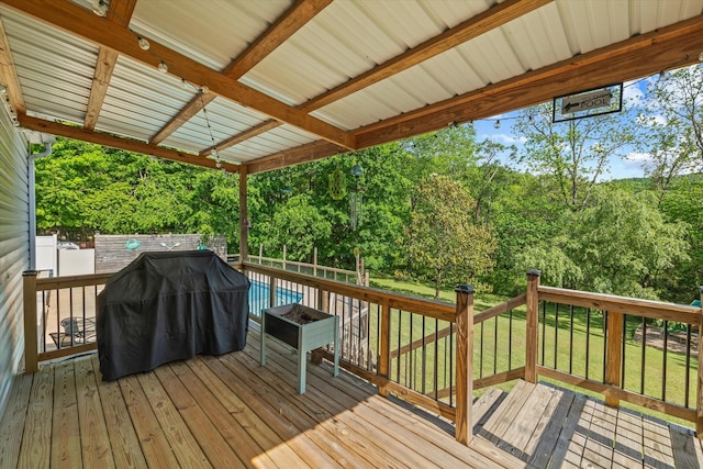 wooden deck featuring a fenced backyard and a yard