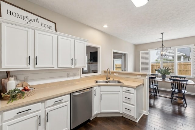kitchen with dark wood-style floors, white cabinetry, a chandelier, a sink, and dishwasher