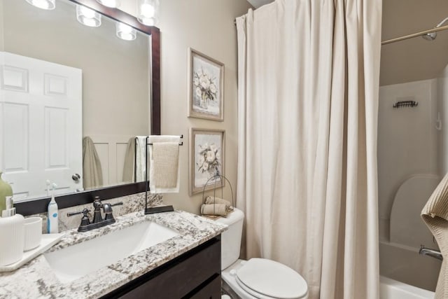 full bathroom featuring vanity, toilet, and shower / tub combo