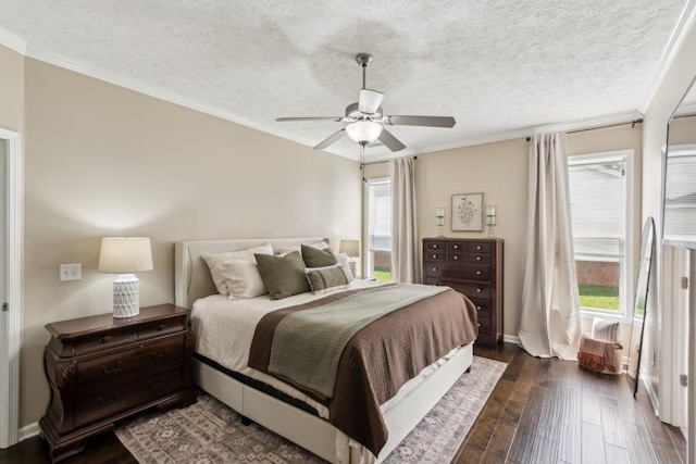 bedroom with crown molding, a textured ceiling, and dark wood-style flooring