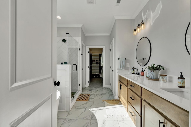 full bath with crown molding, a stall shower, a sink, marble finish floor, and a spacious closet