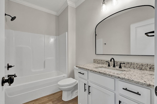 full bath with vanity, toilet, shower / bath combination, wood finished floors, and ornamental molding
