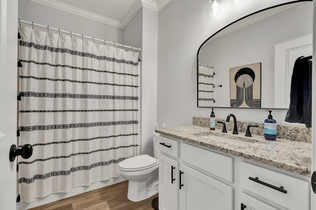 bathroom with a shower with curtain, crown molding, wood finished floors, vanity, and toilet