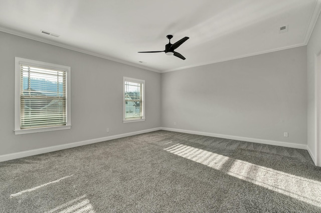 unfurnished room featuring carpet floors, a ceiling fan, baseboards, and ornamental molding