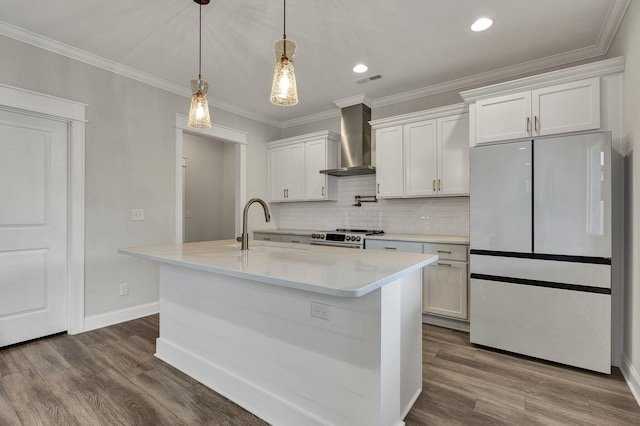 kitchen with stainless steel electric range oven, fridge, a sink, wall chimney exhaust hood, and baseboards