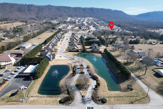 bird's eye view featuring a residential view and a water and mountain view
