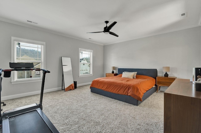 bedroom with baseboards, ornamental molding, carpet, and visible vents