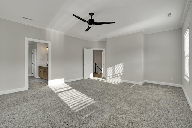 unfurnished bedroom with visible vents, ornamental molding, baseboards, and carpet floors