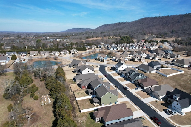 drone / aerial view featuring a residential view and a mountain view