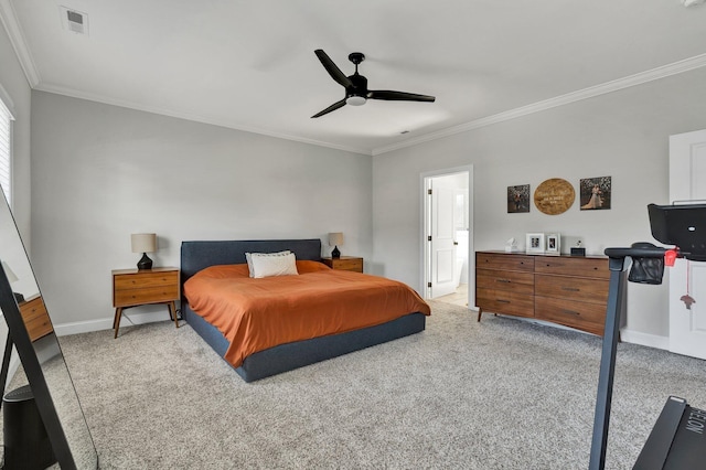 bedroom with carpet floors, baseboards, and crown molding