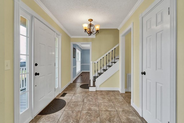1922 W Brookhaven Cir, Dalton, GA 30720 - tiled foyer entrance featuring crown molding, a notable chandelier, and a wealth of natural light