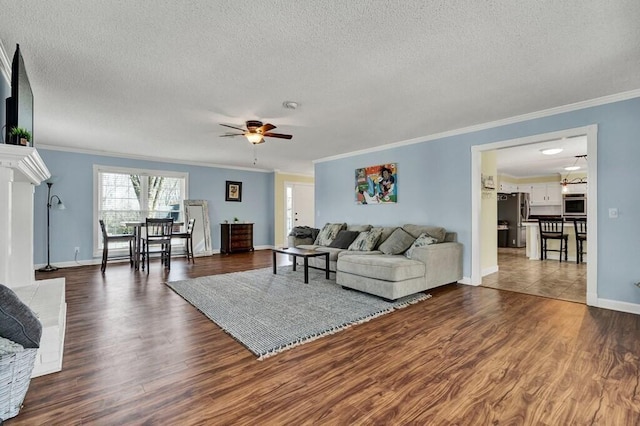 1922 W Brookhaven Cir, Dalton, GA 30720 - living area featuring ornamental molding, a ceiling fan, dark wood finished floors, and a textured ceiling