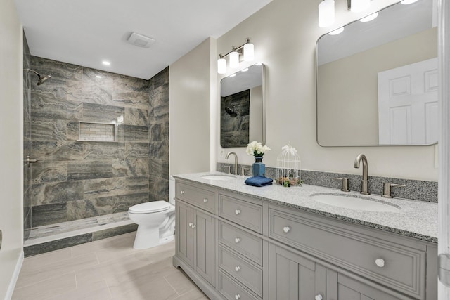 3839 Cleveland Hwy, Dalton, GA 30721 - bathroom featuring toilet, a tile shower, and double vanity