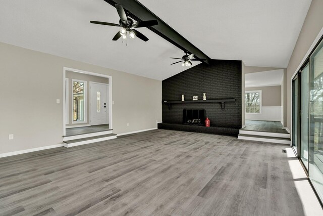 3839 Cleveland Hwy, Dalton, GA 30721 - unfurnished living room featuring a brick fireplace, ceiling fan, and wood finished floors