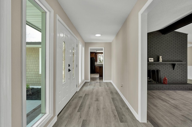 3839 Cleveland Hwy, Dalton, GA 30721 - hallway featuring light wood-style floors, beam ceiling, and baseboards