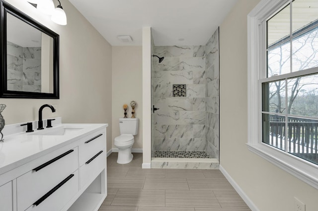 3839 Cleveland Hwy, Dalton, GA 30721 - full bathroom featuring toilet, plenty of natural light, tiled shower, and vanity