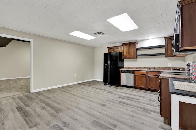 3839 Cleveland Hwy, Dalton, GA 30721 - kitchen featuring stainless steel dishwasher, black fridge with ice dispenser, light wood finished floors, a sink, and open shelves