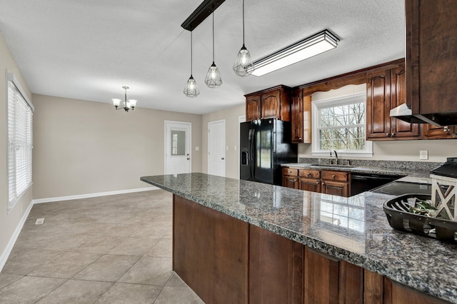 3839 Cleveland Hwy, Dalton, GA 30721 - kitchen featuring black appliances, a sink, a chandelier, a peninsula, and pendant lighting