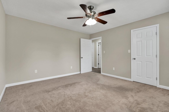 3839 Cleveland Hwy, Dalton, GA 30721 - unfurnished bedroom featuring carpet, baseboards, and a ceiling fan