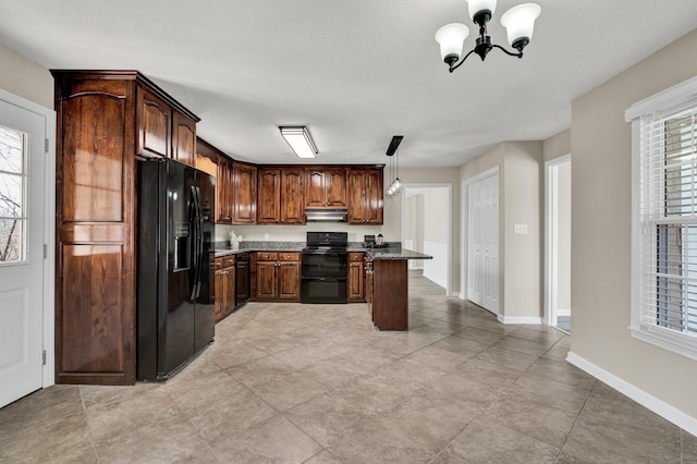 3839 Cleveland Hwy, Dalton, GA 30721 - kitchen featuring black appliances, a chandelier, under cabinet range hood, pendant lighting, and baseboards