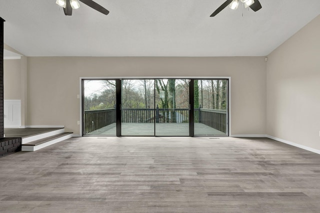 3839 Cleveland Hwy, Dalton, GA 30721 - spare room with a ceiling fan, plenty of natural light, lofted ceiling, and wood finished floors