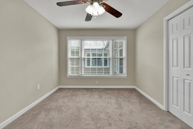 3839 Cleveland Hwy, Dalton, GA 30721 - empty room with carpet flooring, baseboards, a textured ceiling, and a ceiling fan