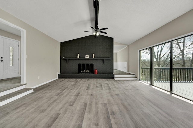 3839 Cleveland Hwy, Dalton, GA 30721 - unfurnished living room featuring a ceiling fan, wood finished floors, and a fireplace