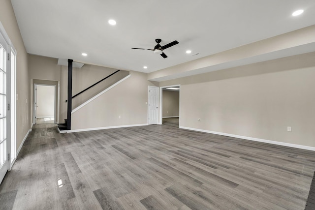 3839 Cleveland Hwy, Dalton, GA 30721 - unfurnished living room featuring ceiling fan, baseboards, stairway, wood finished floors, and recessed lighting