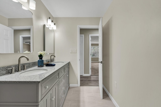3839 Cleveland Hwy, Dalton, GA 30721 - bathroom featuring baseboards and double vanity