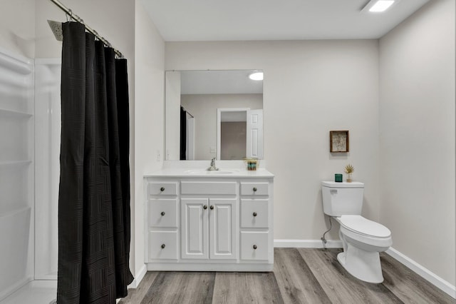 3839 Cleveland Hwy, Dalton, GA 30721 - bathroom featuring wood finished floors, toilet, baseboards, vanity, and a shower with shower curtain