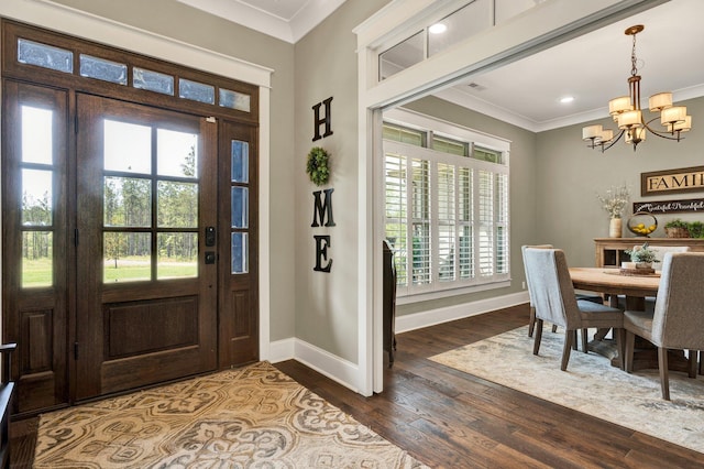 entryway featuring crown molding, dark wood-style flooring, baseboards, recessed lighting, and a notable chandelier