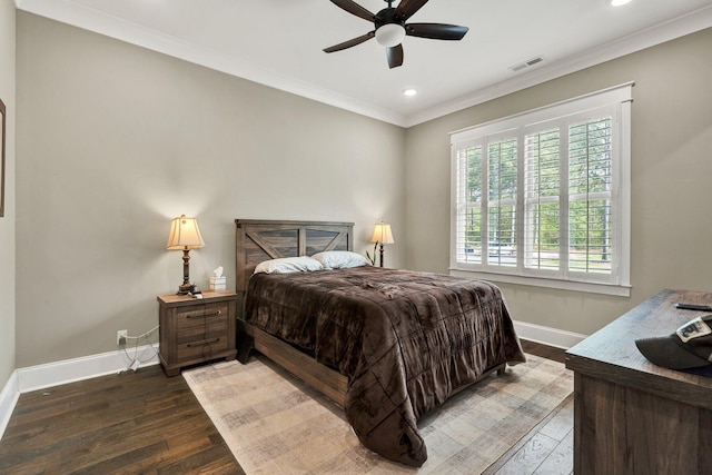 bedroom with visible vents, ornamental molding, wood finished floors, baseboards, and recessed lighting