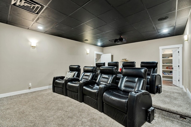 cinema featuring carpet flooring, baseboards, visible vents, and a paneled ceiling