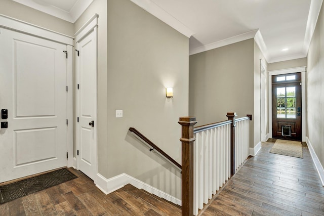 entrance foyer featuring crown molding, baseboards, recessed lighting, and dark wood-style flooring