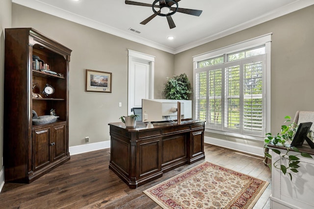 home office featuring a ceiling fan, visible vents, baseboards, dark wood-style floors, and ornamental molding