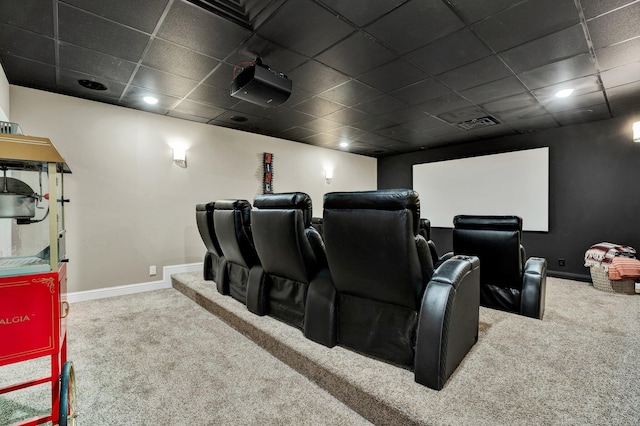 carpeted cinema room featuring baseboards, recessed lighting, a paneled ceiling, and visible vents