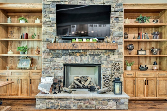 living room featuring dark wood finished floors and a fireplace