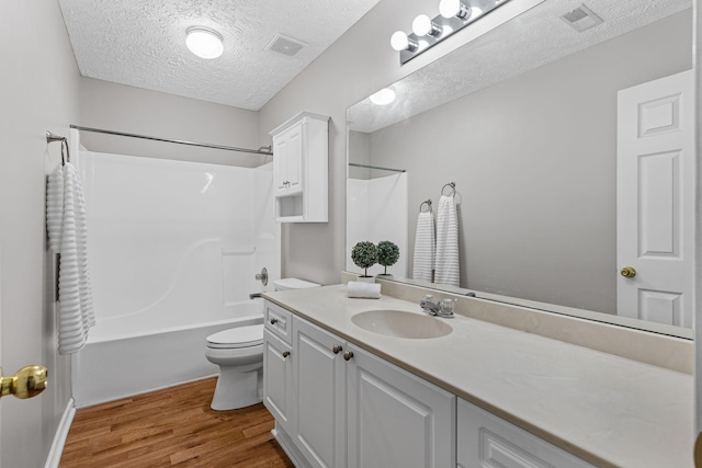 800 S Browns Ln Unit I1, Gallatin, TN 37066 - bathroom featuring vanity, toilet, a textured ceiling, wood finished floors, and visible vents