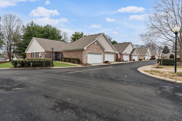 800 S Browns Ln Unit I1, Gallatin, TN 37066 - view of street with curbs, street lights, and a residential view