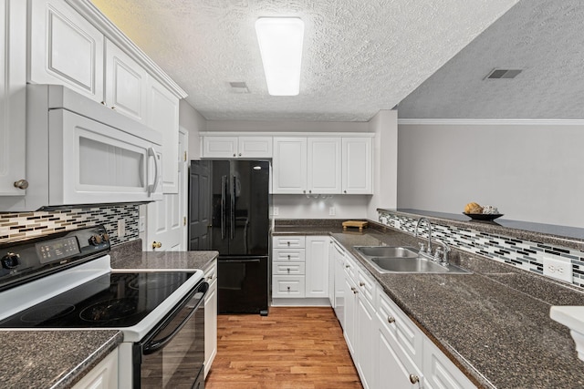 800 S Browns Ln Unit I1, Gallatin, TN 37066 - kitchen with freestanding refrigerator, a sink, white microwave, electric stove, and light wood finished floors