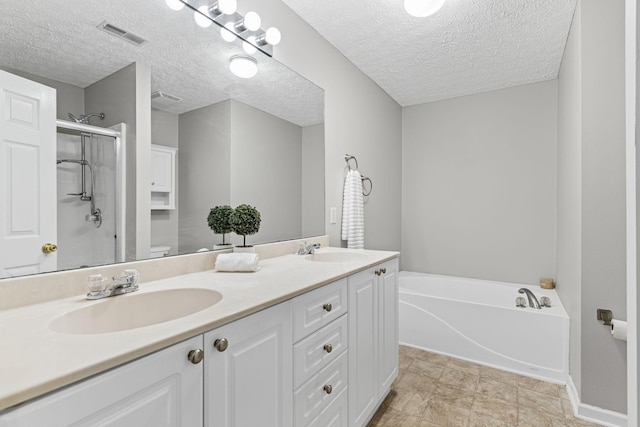 800 S Browns Ln Unit I1, Gallatin, TN 37066 - bathroom featuring a sink, a shower stall, double vanity, and visible vents