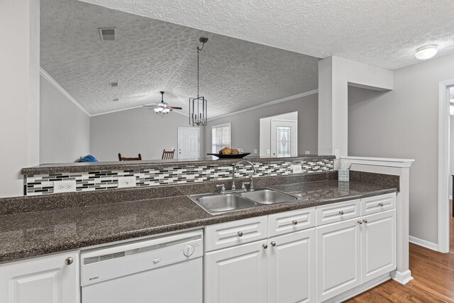 800 S Browns Ln Unit I1, Gallatin, TN 37066 - kitchen with ornamental molding, white dishwasher, a textured ceiling, a sink, and light wood-style flooring