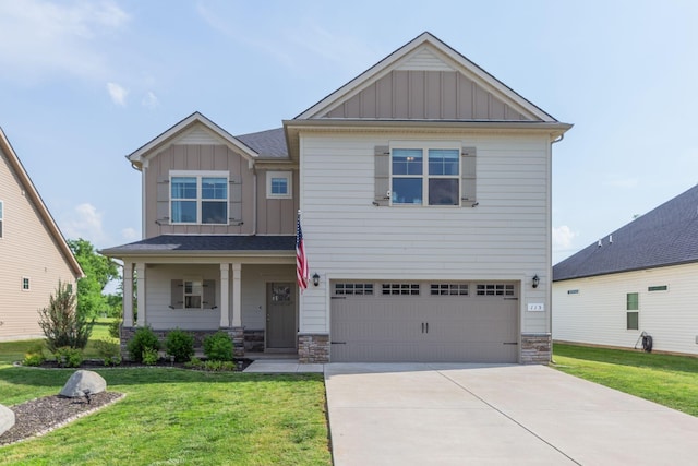 craftsman house with a garage, board and batten siding, covered porch, and a front yard