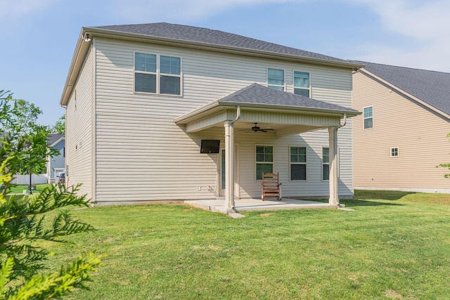 back of property featuring a yard, a ceiling fan, and a patio area