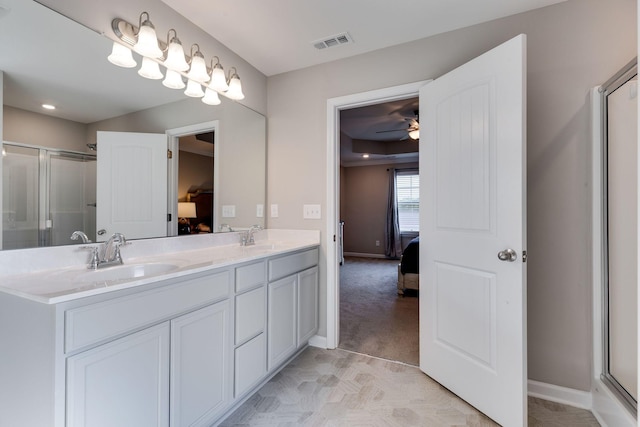 ensuite bathroom featuring visible vents, a sink, and ensuite bath