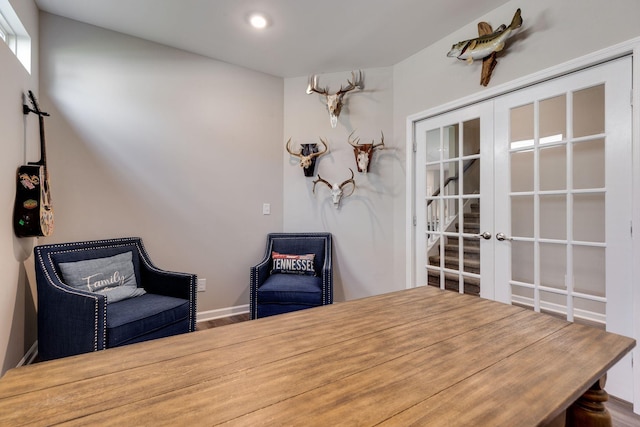 sitting room with french doors and recessed lighting
