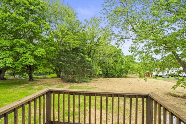 wooden terrace with a yard