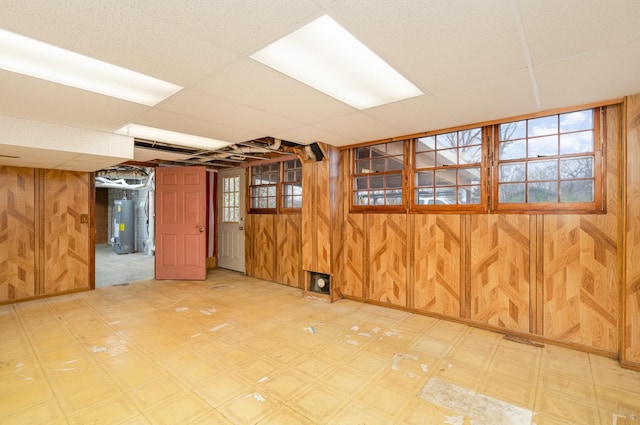 905 Crownhill Dr, Nashville, TN 37217 - below grade area with wood walls, water heater, and light floors