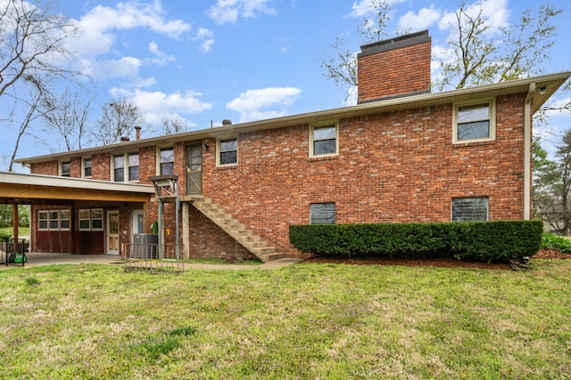 905 Crownhill Dr, Nashville, TN 37217 - rear view of property with a chimney, a lawn, brick siding, central AC, and stairs