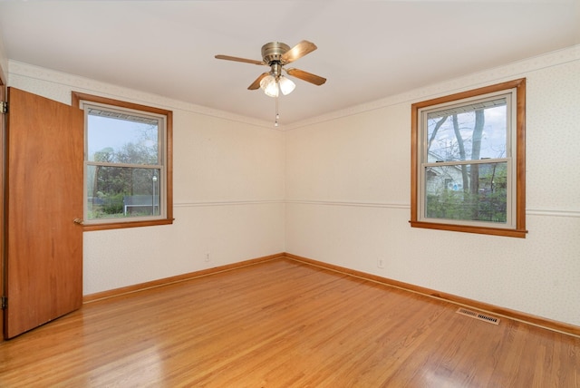 905 Crownhill Dr, Nashville, TN 37217 - empty room with visible vents, baseboards, ceiling fan, wallpapered walls, and light wood-type flooring